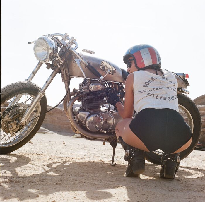 A playful frame from Girls on a motorcycle — online in Brisbane